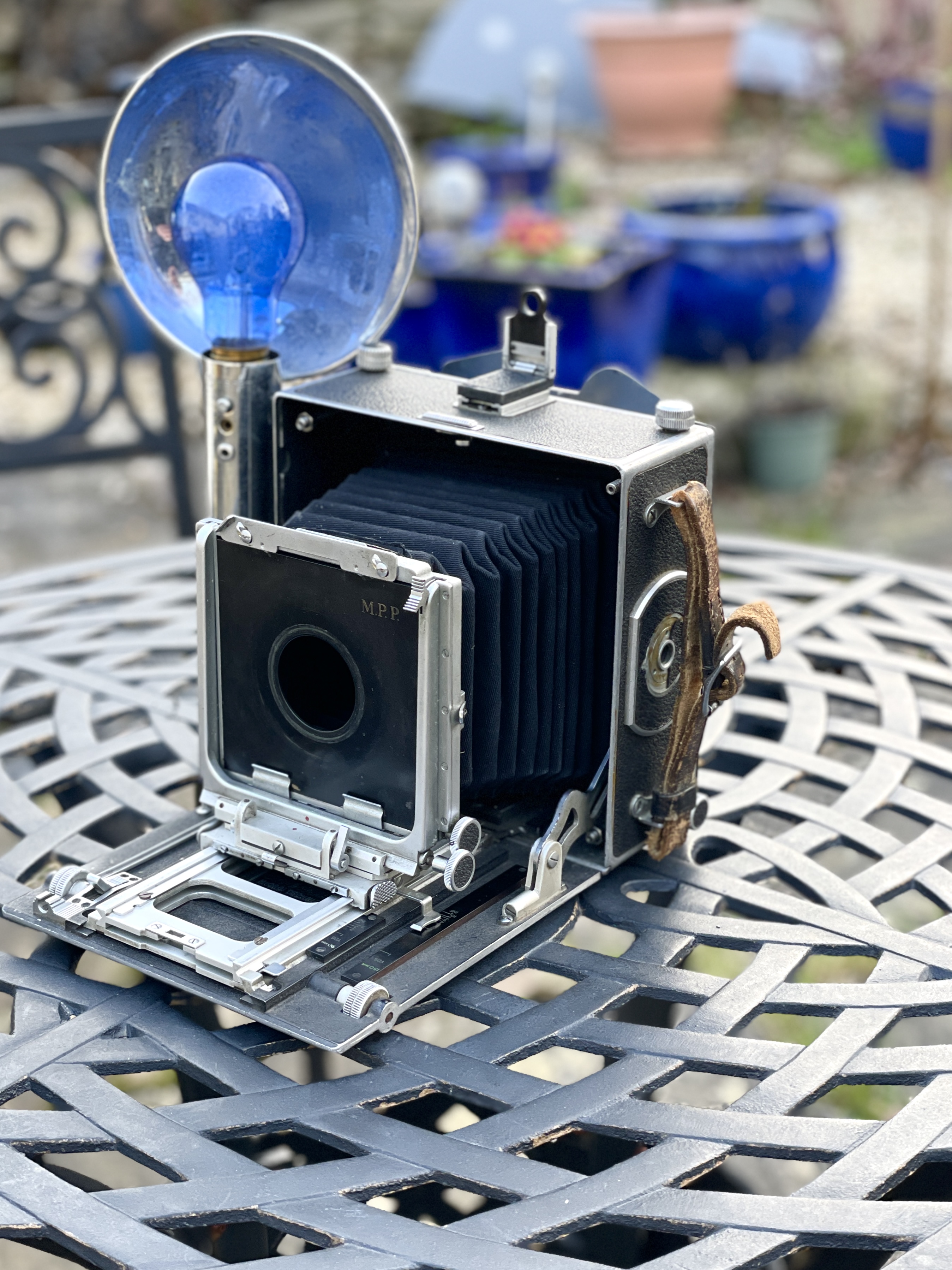 Period paparazzi film and bulb flash plate camera working.