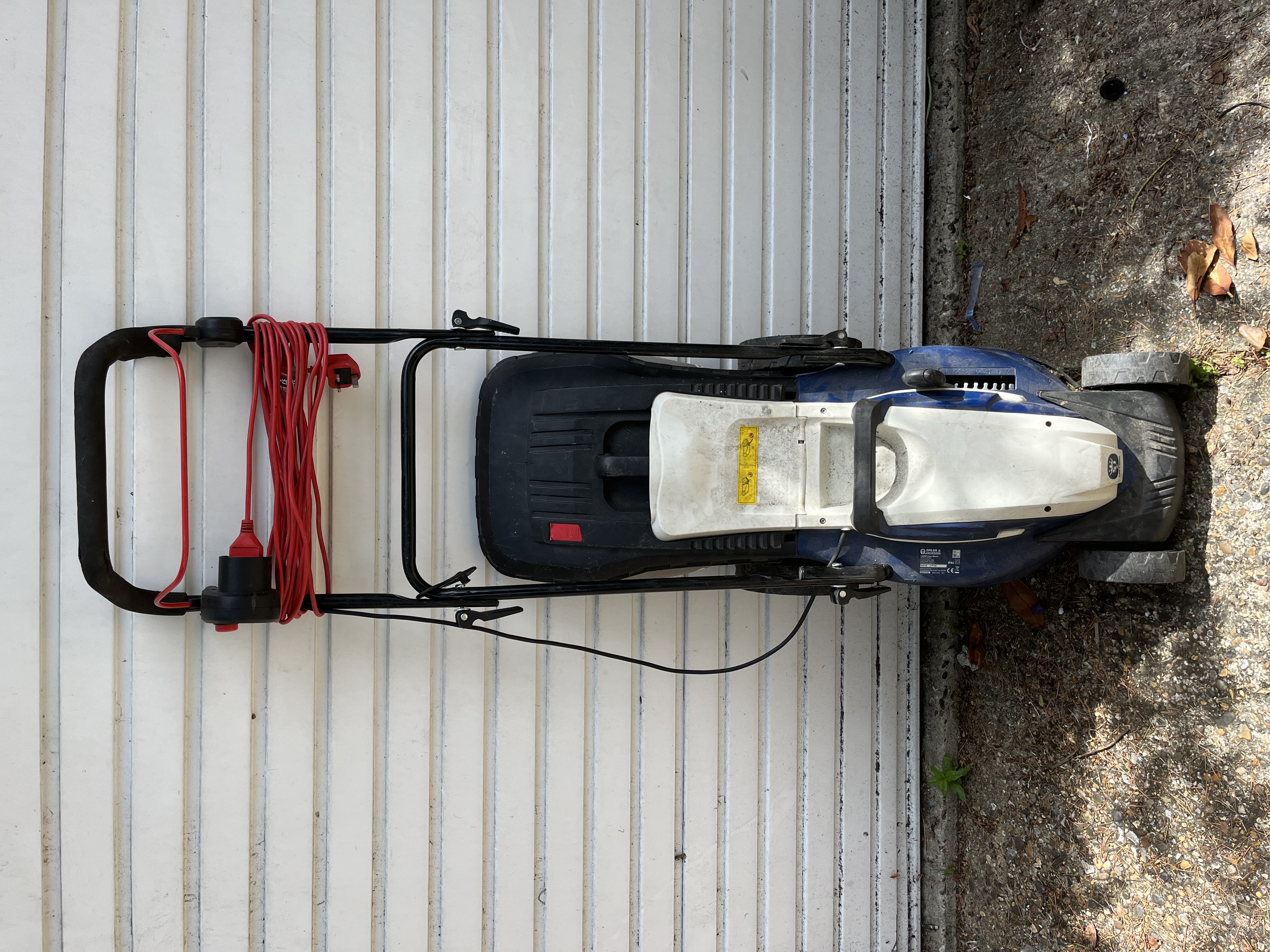  spear & jackson 34cm corded electric rotary lawn mower, likely the lm1300 model [5, 11].