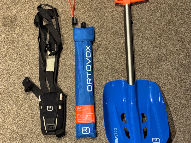 Ski/ snowboard backcountry kit. ortovox avalanche transceiver, shovel and probe