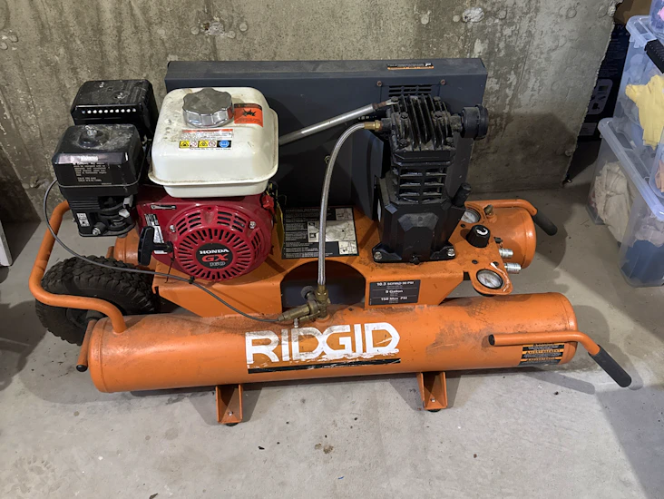 Rigid gas powered compressor