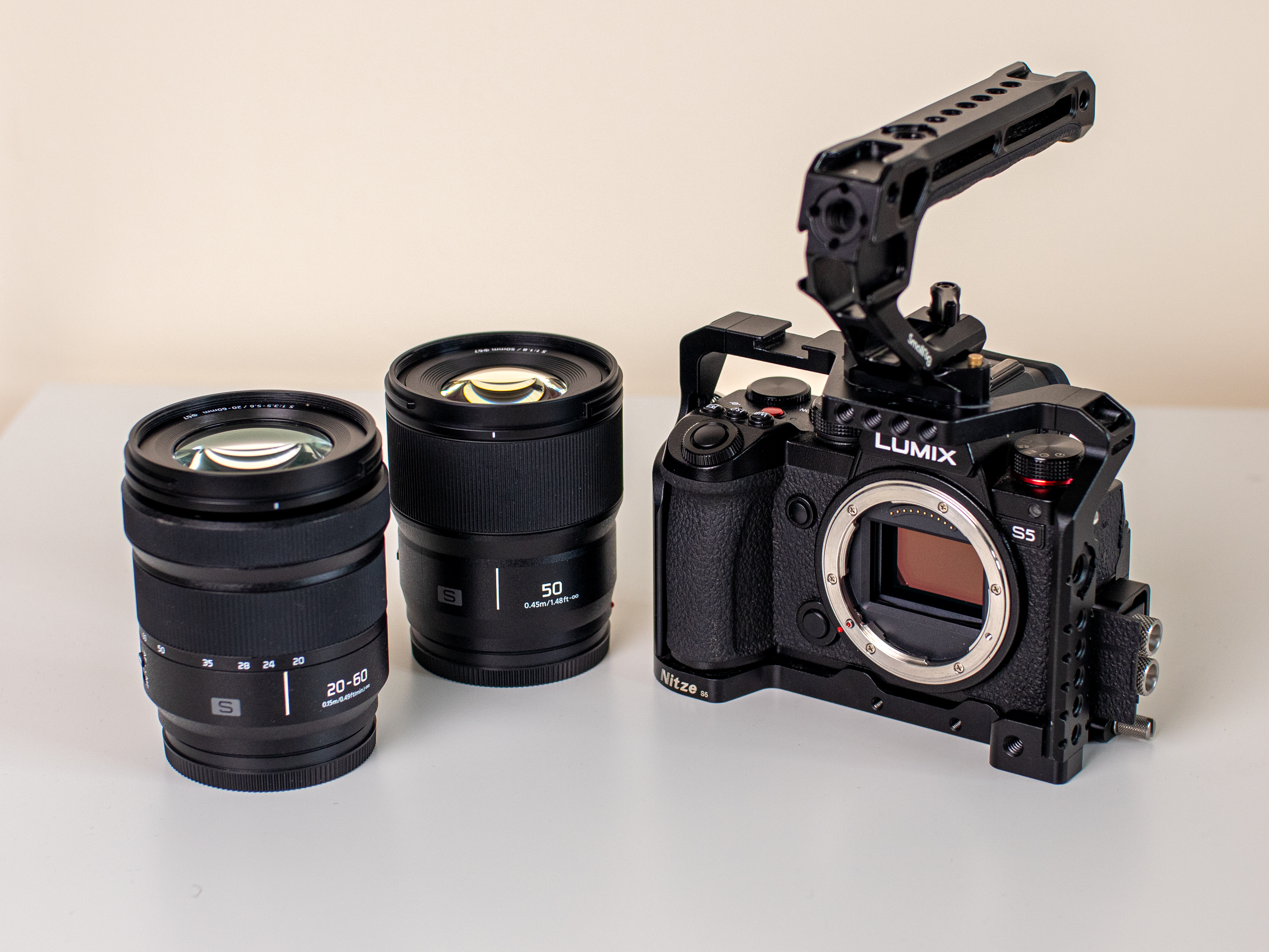 Panasonic lumix s5 + 50mm & 20-60mm lens + cage & top handle