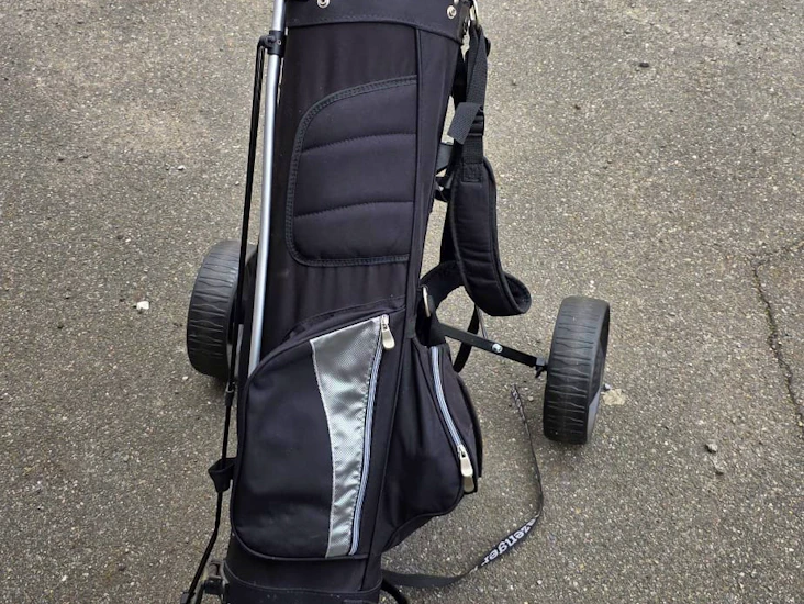 Golf clubs and bag right handed man