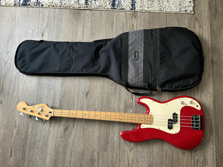 Red 4 string electric bass guitar