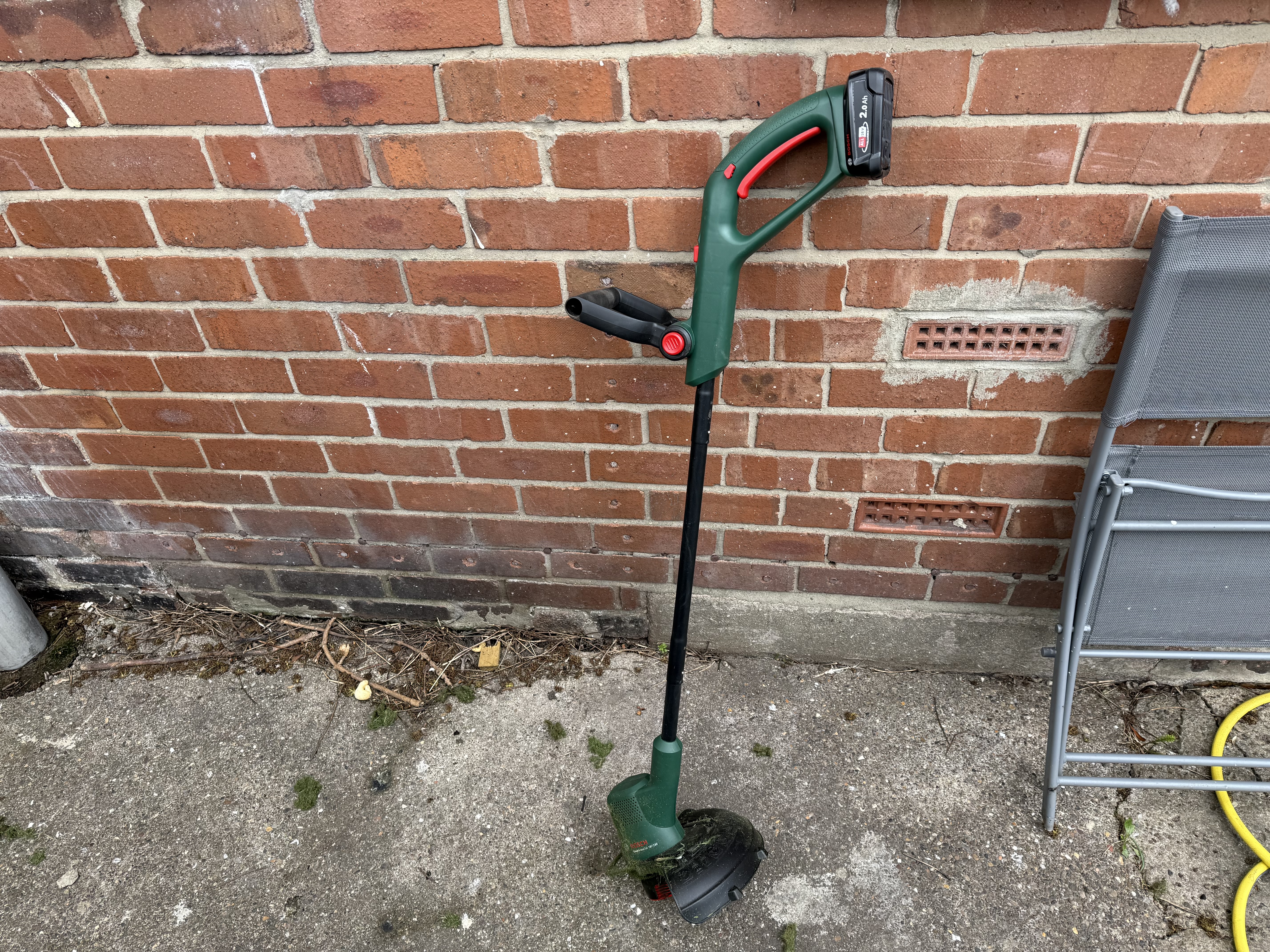 Bosch cordless strimmer with battery and charger