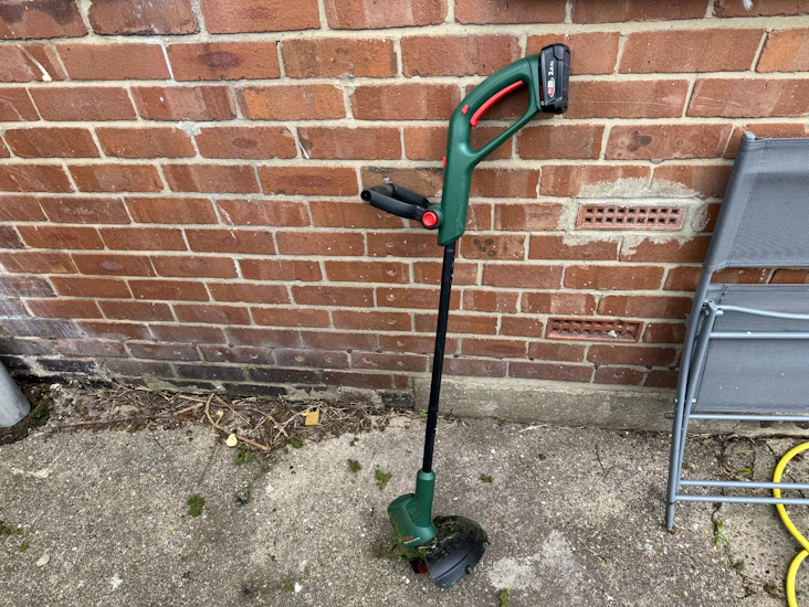 Bosch cordless strimmer with battery and charger