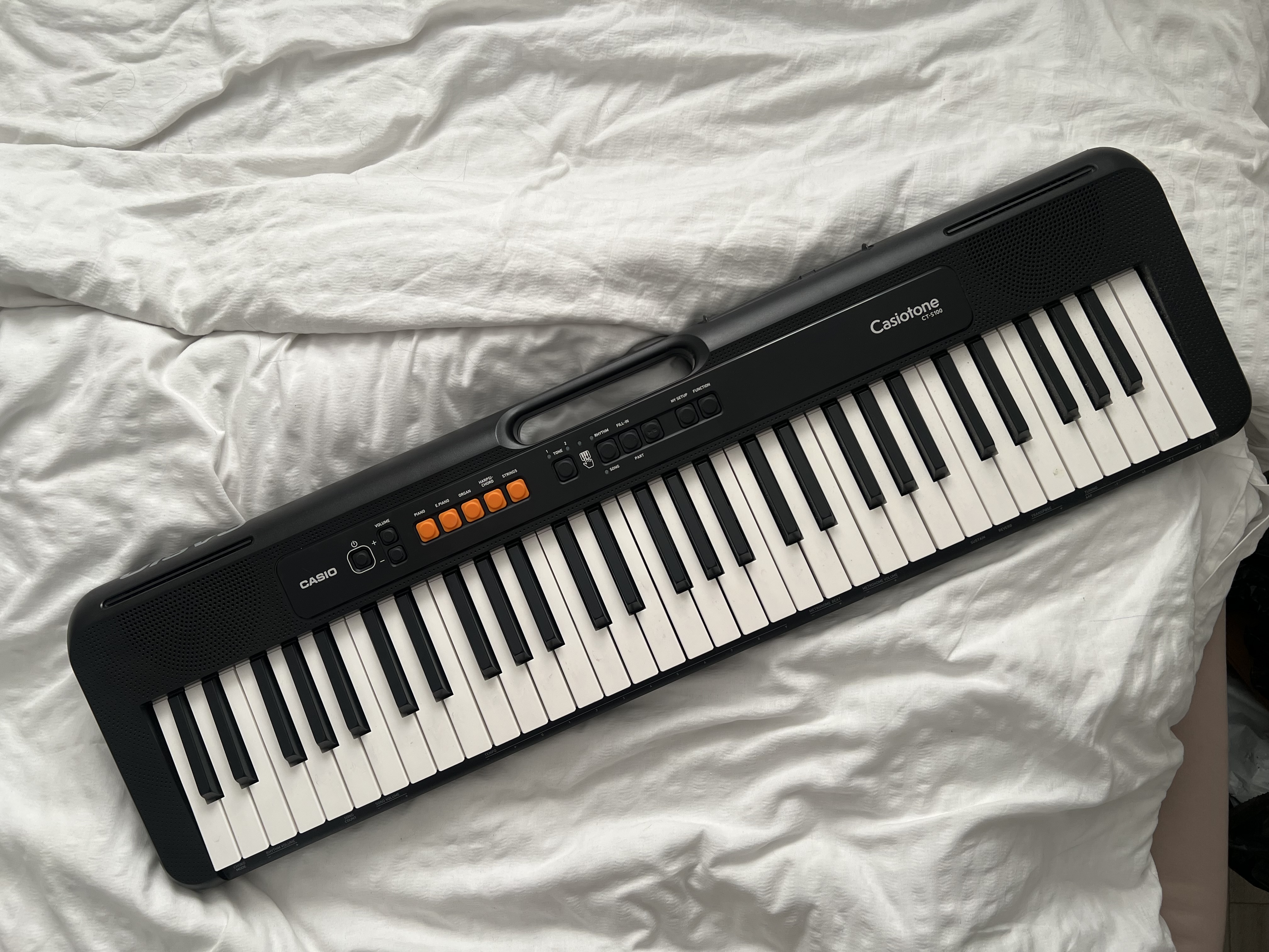 Casio keyboard with stand and headphones 