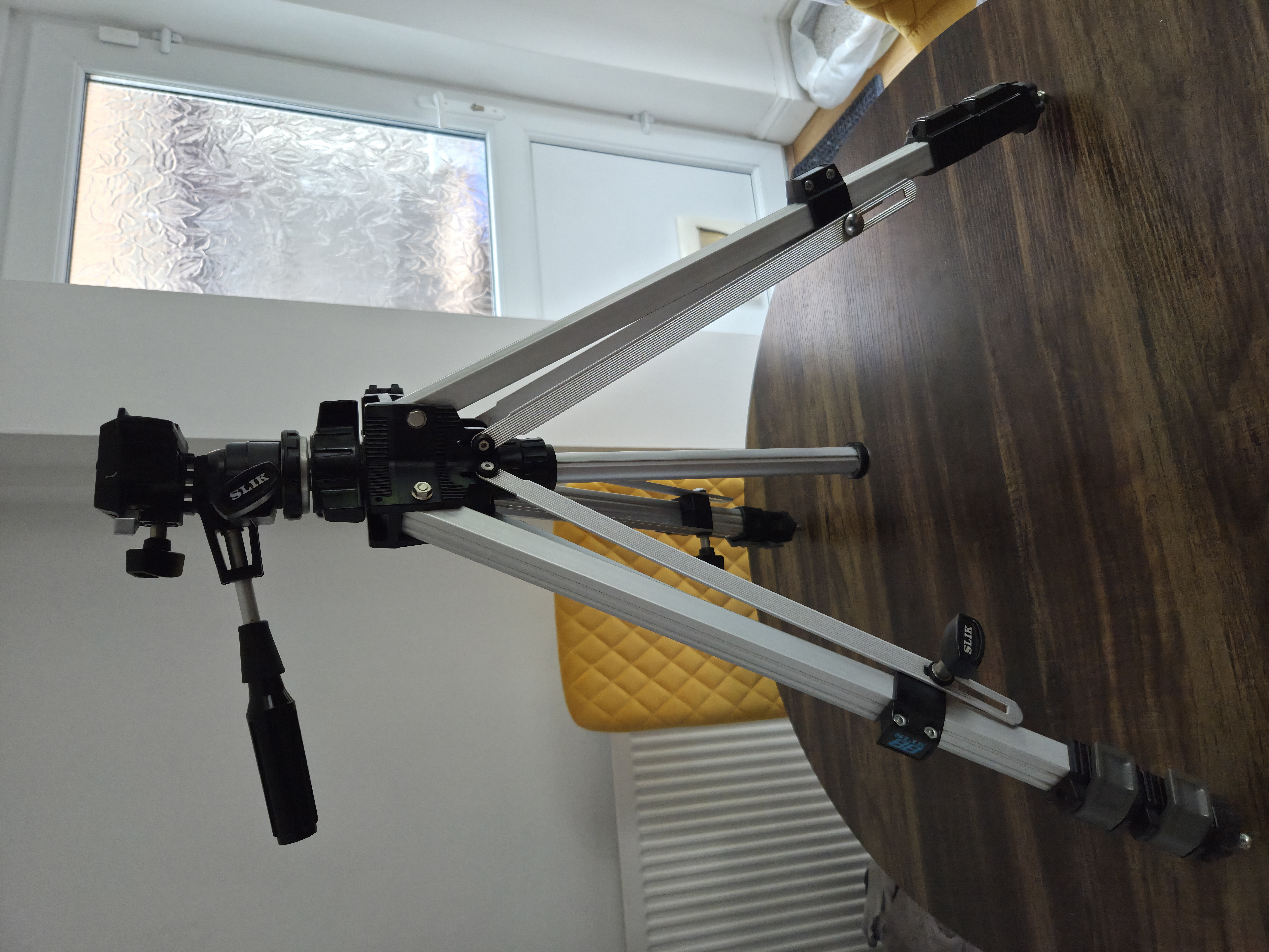 Sturdy slik tripod for cameras – adjustable height, quick setup