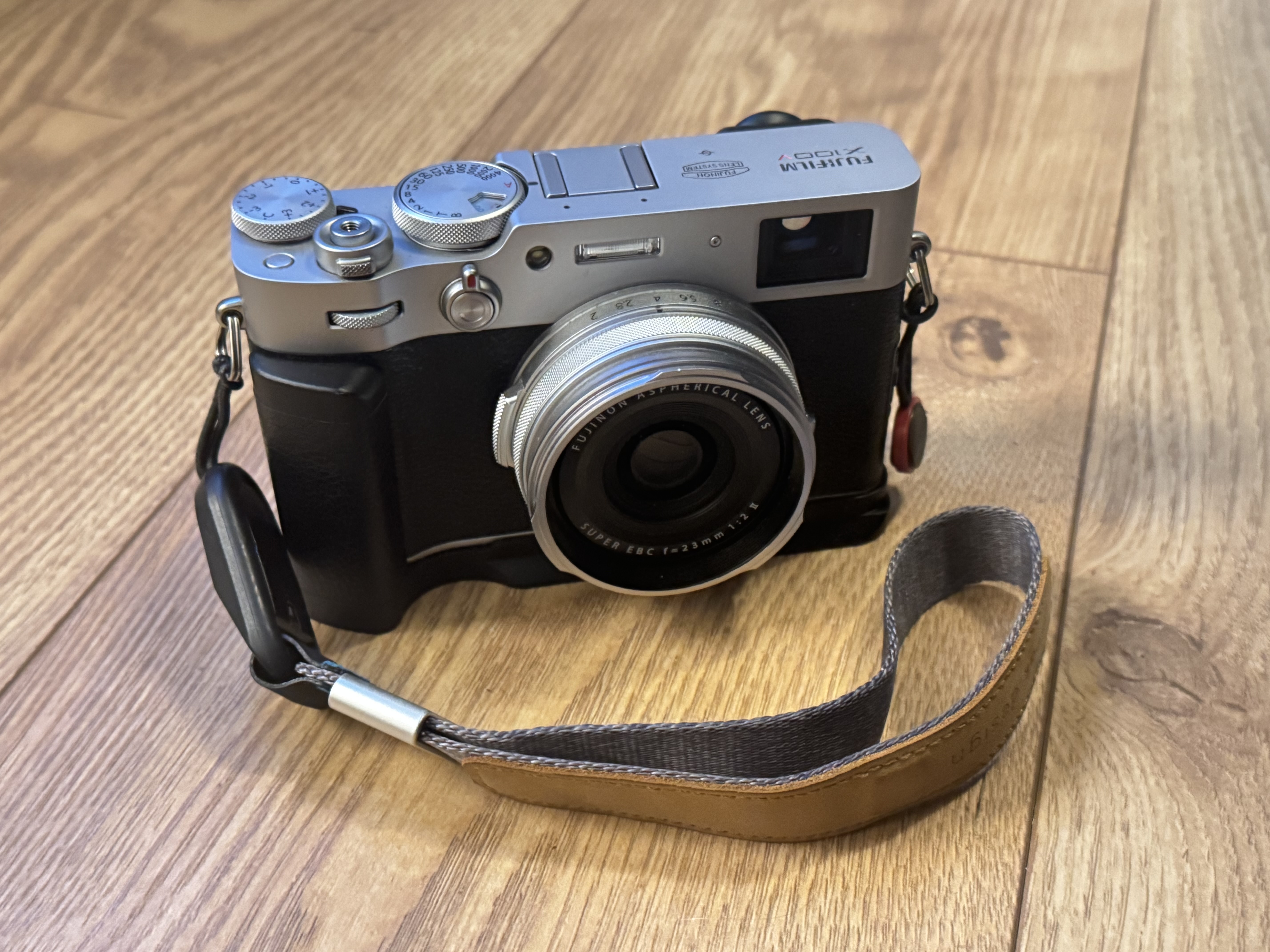 Fujifilm x100v camera w/sd card, spare battery, and wrist strap