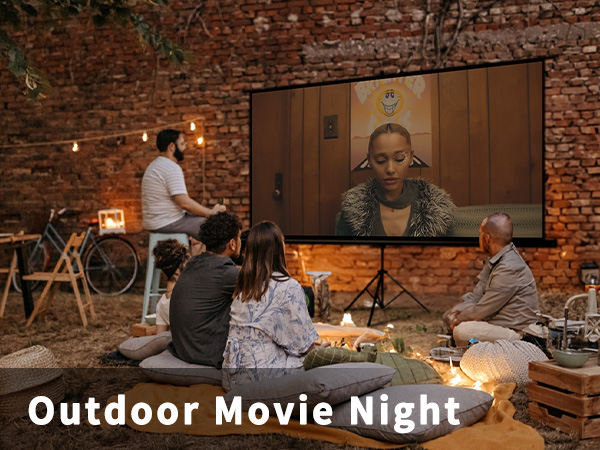 Movie night in garde with projector screen and speakers