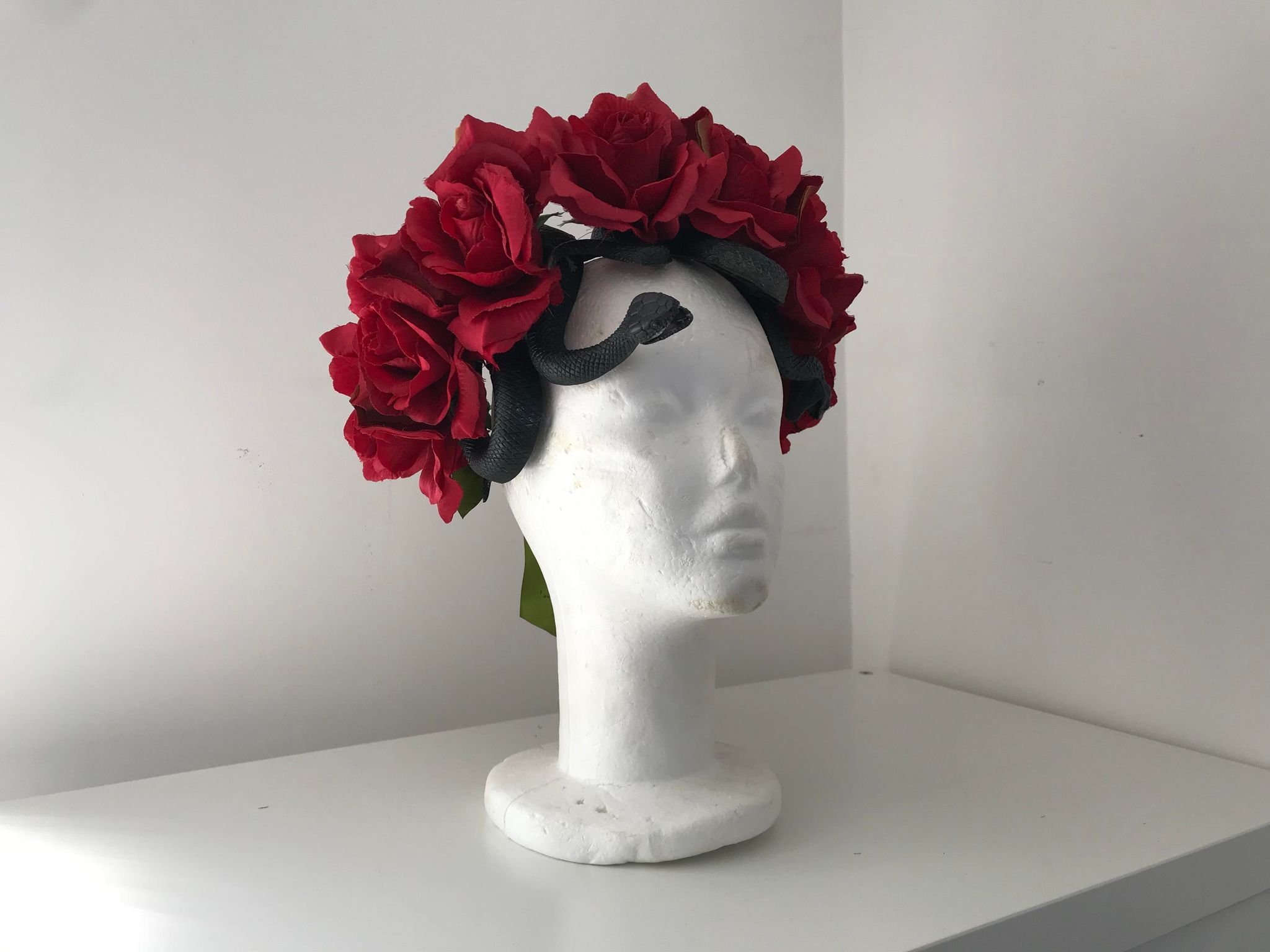 Red roses headdress with snakes