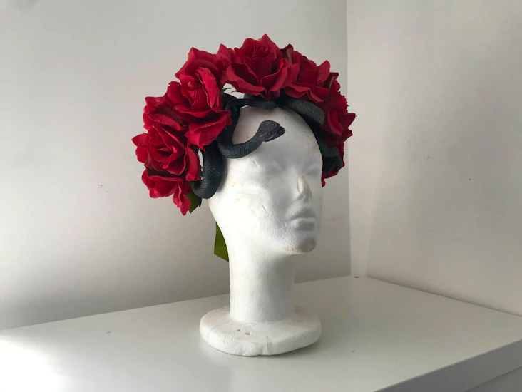 Red roses headdress with snakes