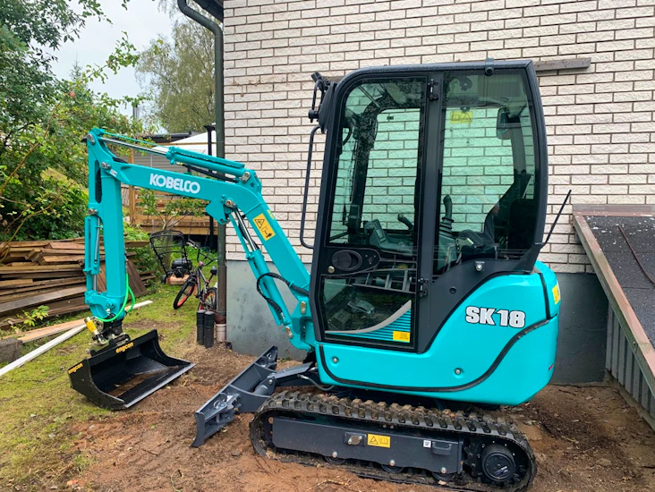 Minigrävare med grävhjälp