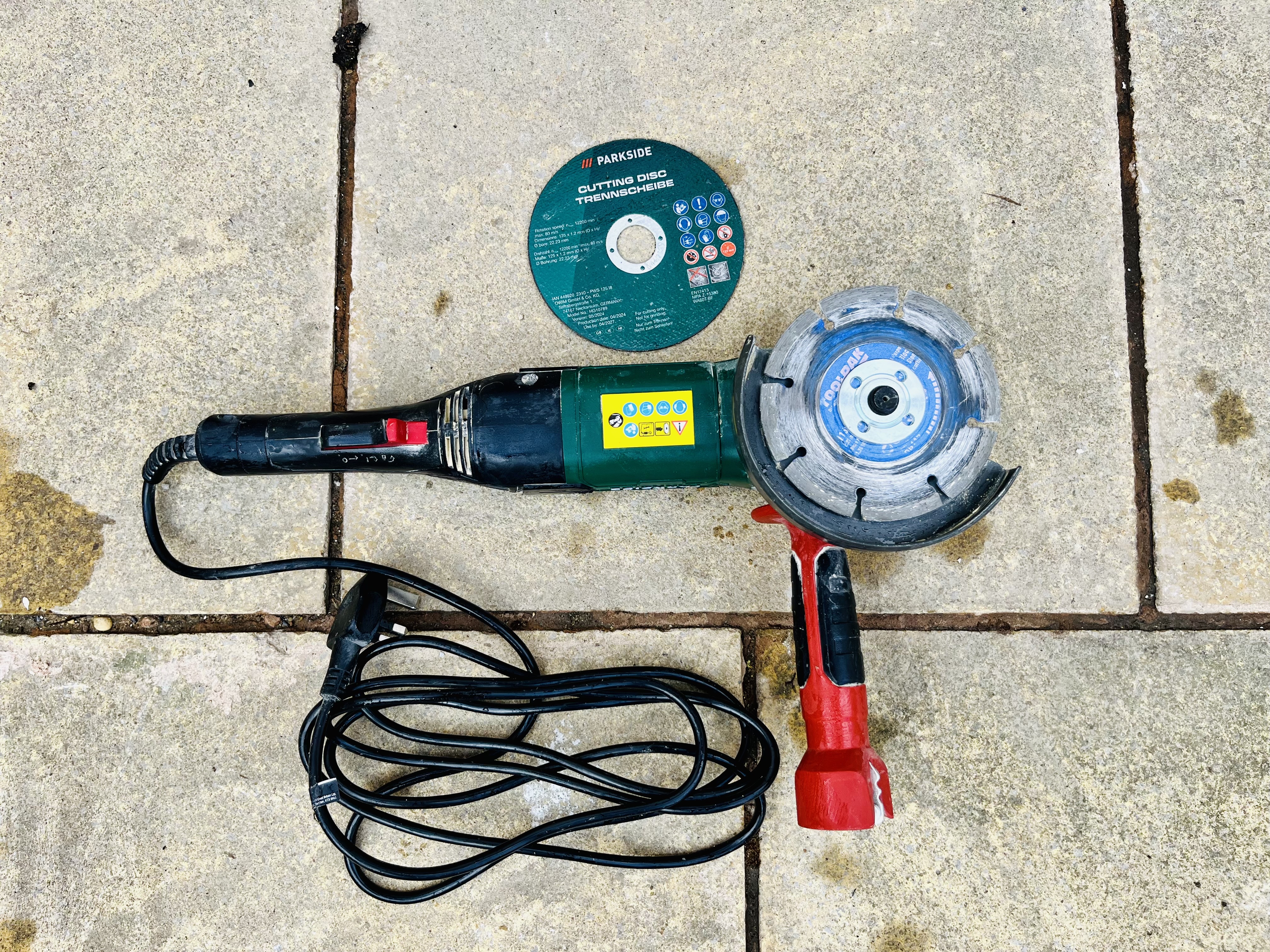 Angle grinder with masonry and wood cutting discs
