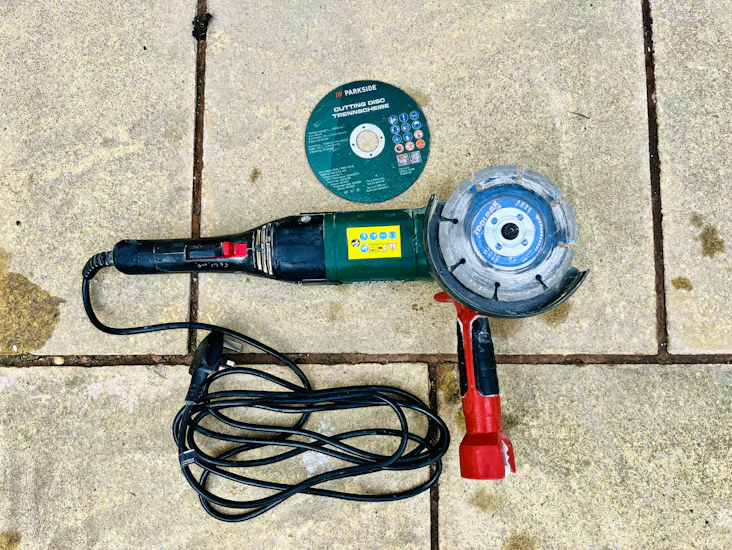 Angle grinder with masonry and wood cutting discs