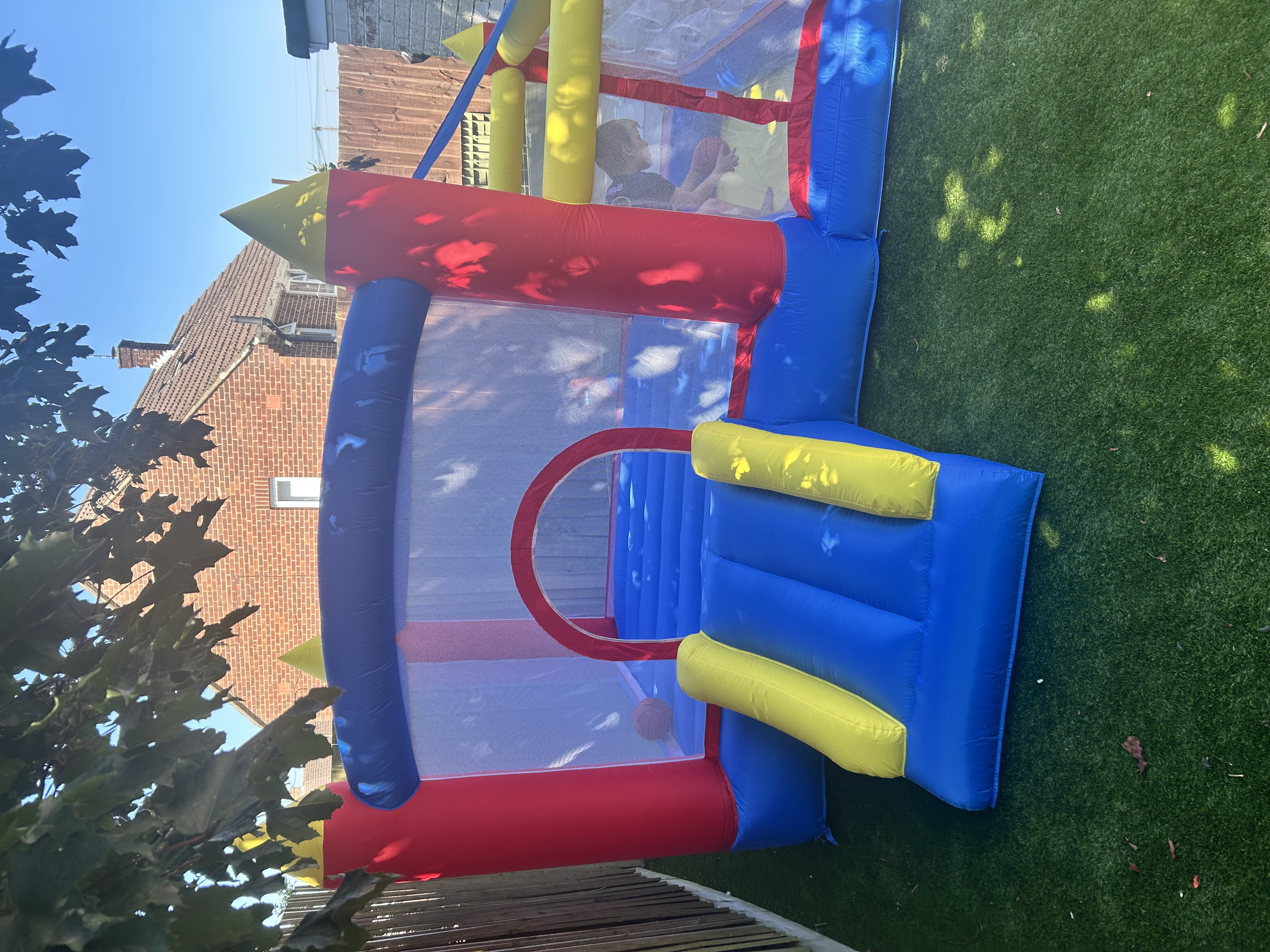 Small child's bouncy castle with paddling pool 
