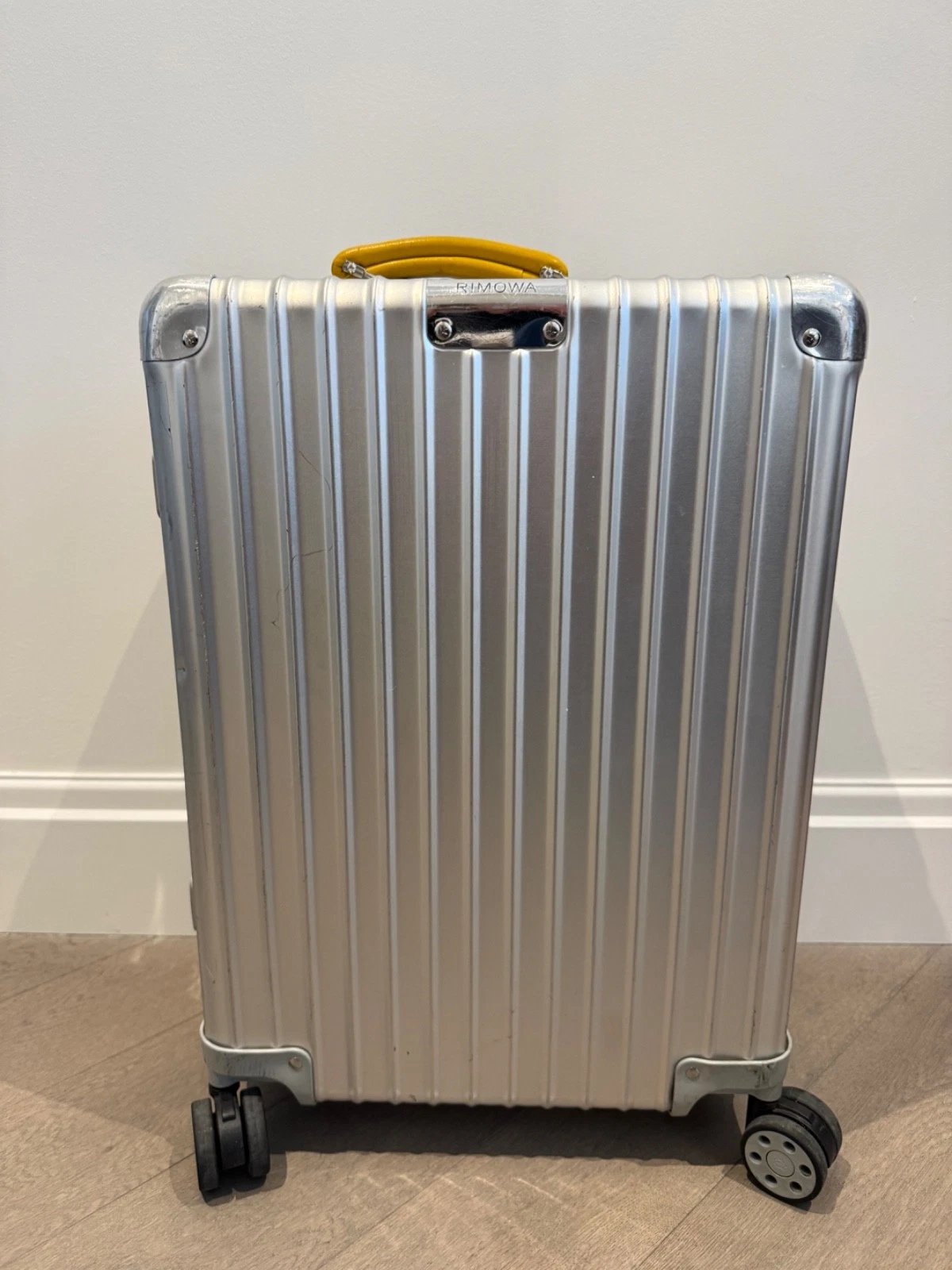 Rimowa carry-on roller suitcase