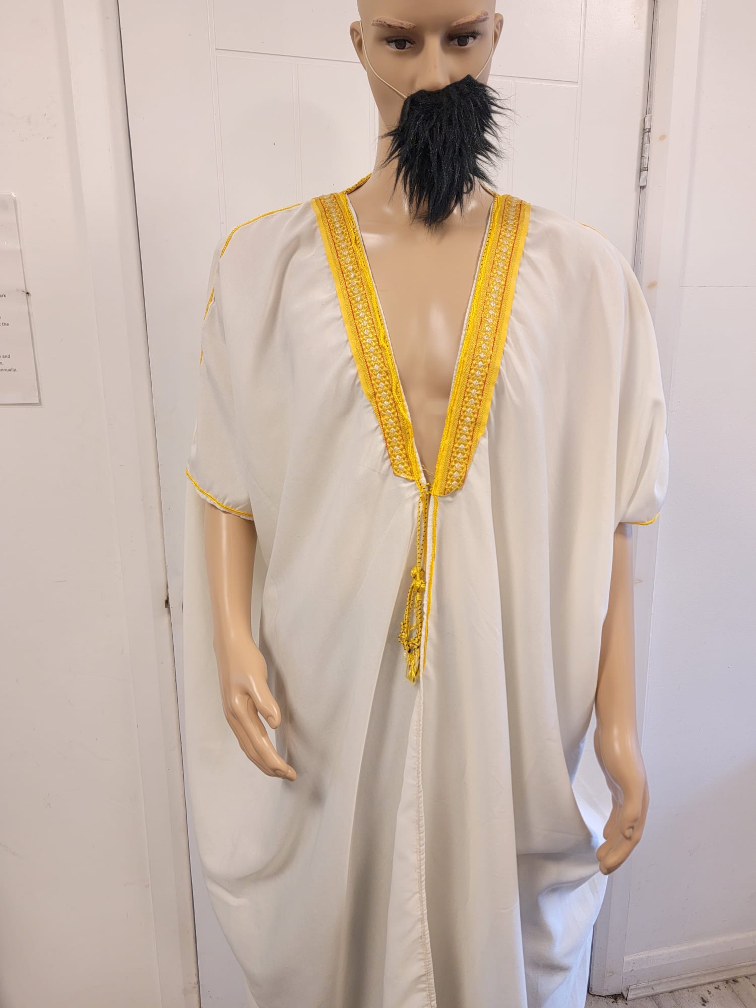 White gown with gold hem
