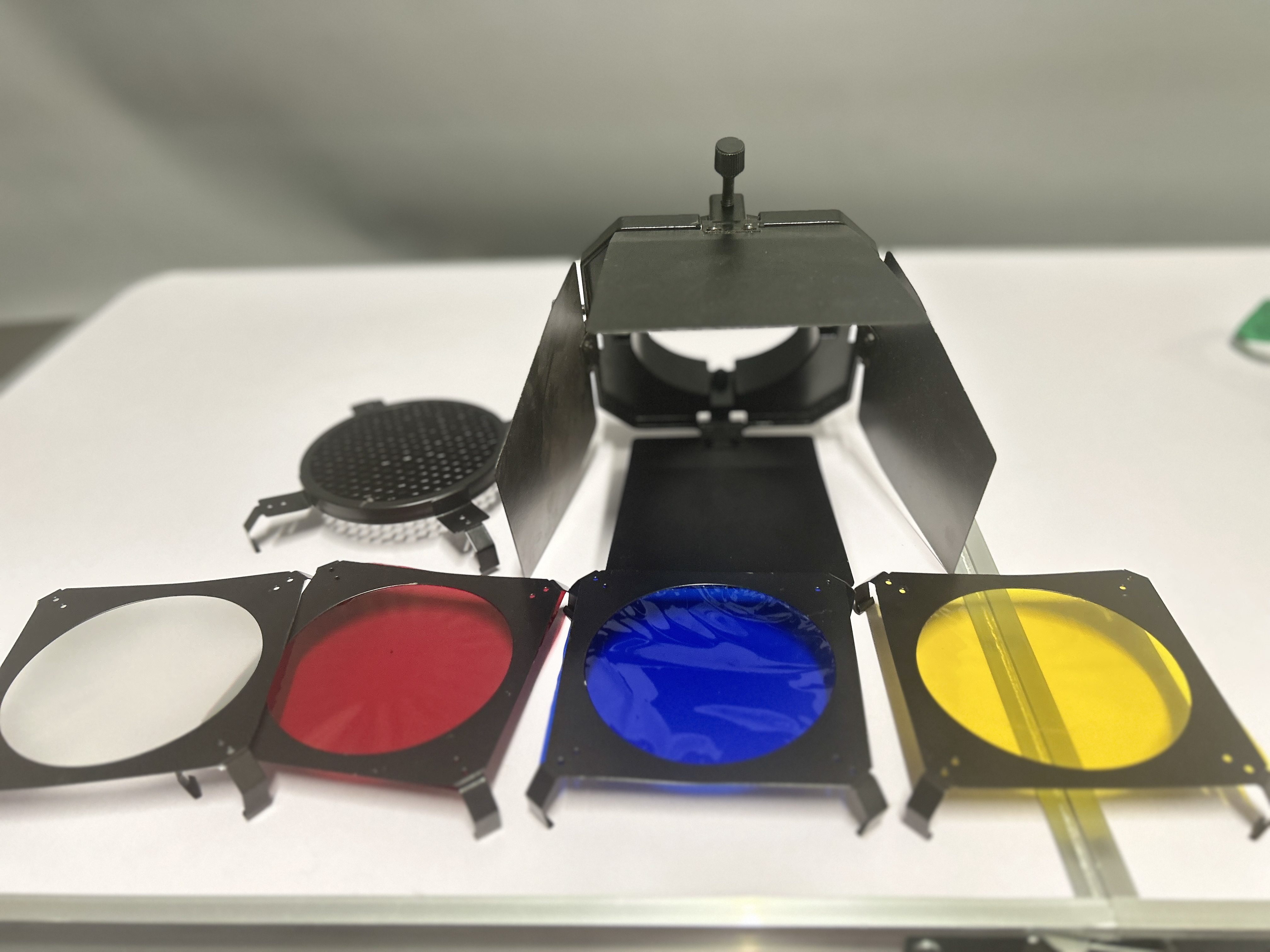 The flash barndoor comes with 4 color gel filters and a honeycomb grid, serving
