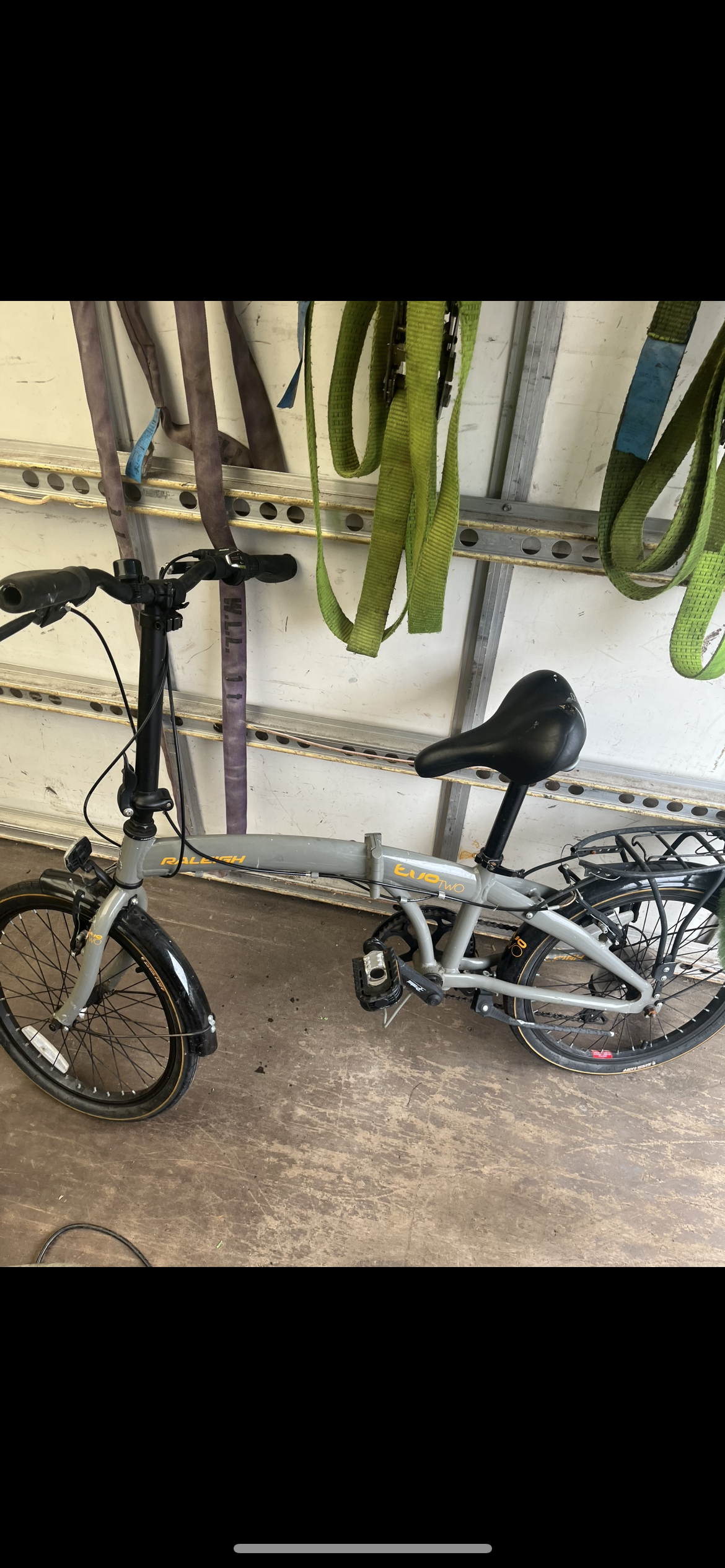 Raleigh evo 2 is a folding bike featuring 7-speed shimano gears and a grey frame